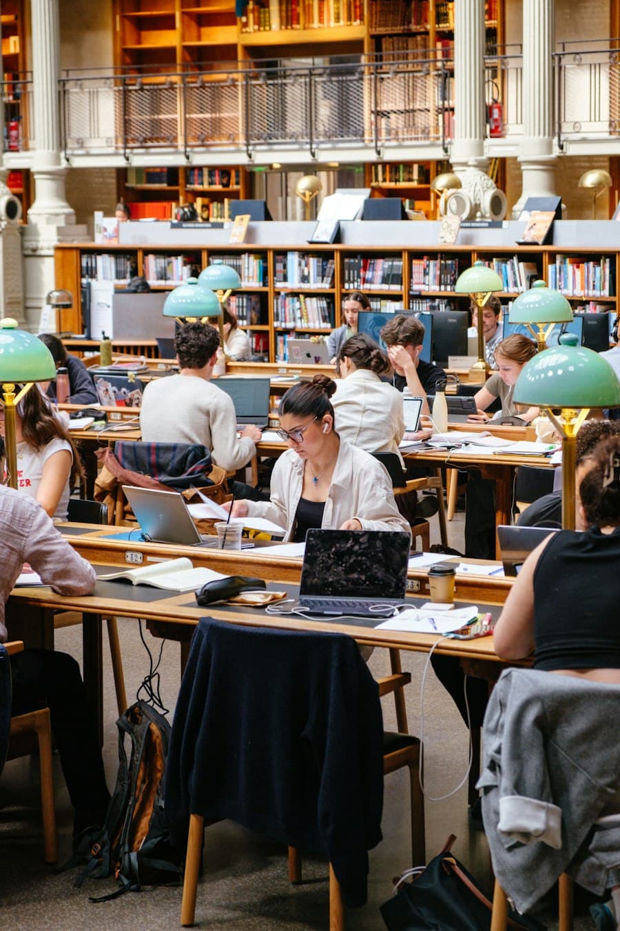 Students studying in a library reading room